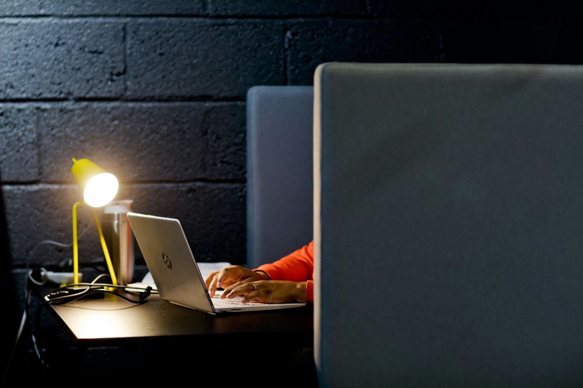 woman working on laptop - Deepgram Pricing
