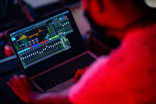person adjusting audio - What Is Speech Synthesis